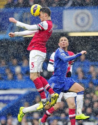 Arsenal's Thomas Vermaelen and Chelsea's Fernando Torres during their match in London on January 20, 2013